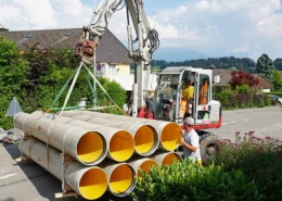 Flowtite Orange pipes on forklift for stream culvert project in Eschenbach, Switzerland