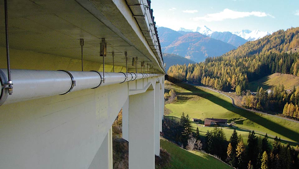 GRP pipes under bridge on suspensions