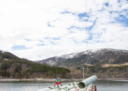 Helicopter transporting Amiblu Flowtite pressure pipes for hydropower plant project Breivikelva, NO