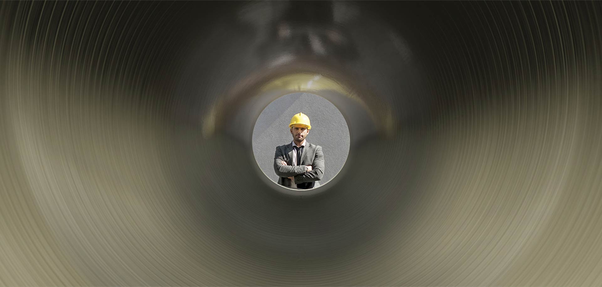 Man looking through GRP pipe